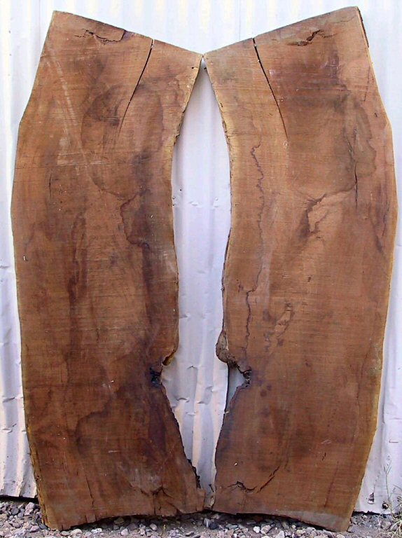 A small mesquite kitchen table with a thick natural edge book-matched top.