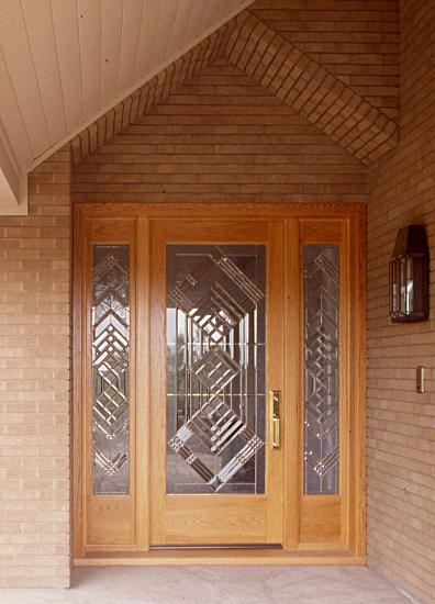 Red oak door with sidelights and beveled glass