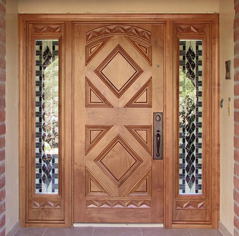 Entry door with sidelites, stained glass, and geometric designs