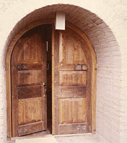 Rustic arched double doors