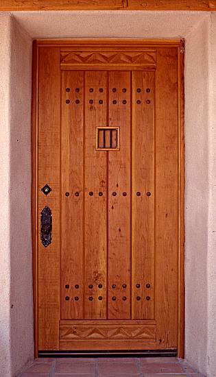 Rustic fir door with speakeasy